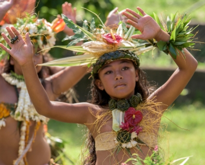 A schoolgirl performs a traditional Polynesian Haka dance during a presentation on the island of Fatu Hiva