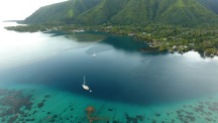 Flying Fish is at anchor (foreground) in Vaianae Bay, Mo'orea. Photo: Skydive Tahiti