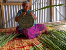 Veisinia Falevia prepares pandanus leaves for weaving at her home in the Ha'apai Islands