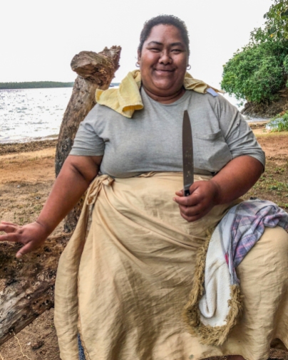 Laveni Tatafa from Nuapapu Island in a happy pose with her coconut husking knife